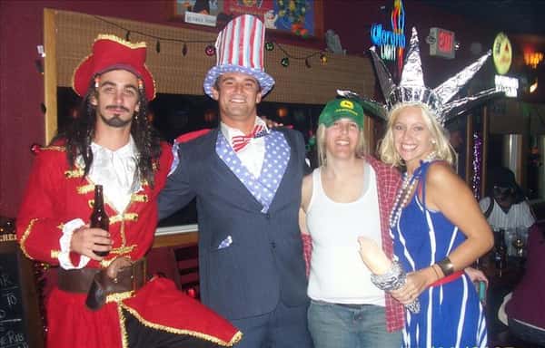 people dressed as a pirate, uncle sam, a trucker, and the statue of liberty