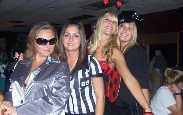 four friends in Halloween costumes