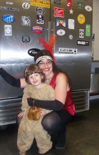 a woman and a child in Halloween costumes