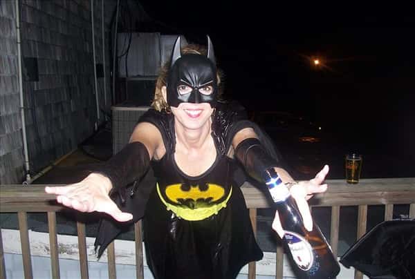 a woman dressed as Batman