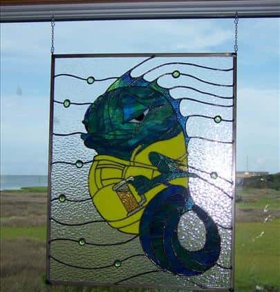 a glass mosaic of a cartoon fish holding a mug of beer