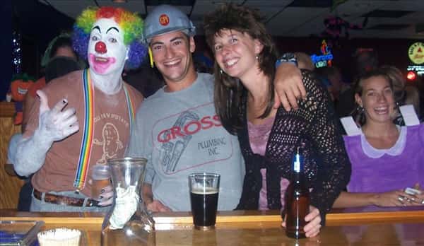 three friends in Halloween costumes