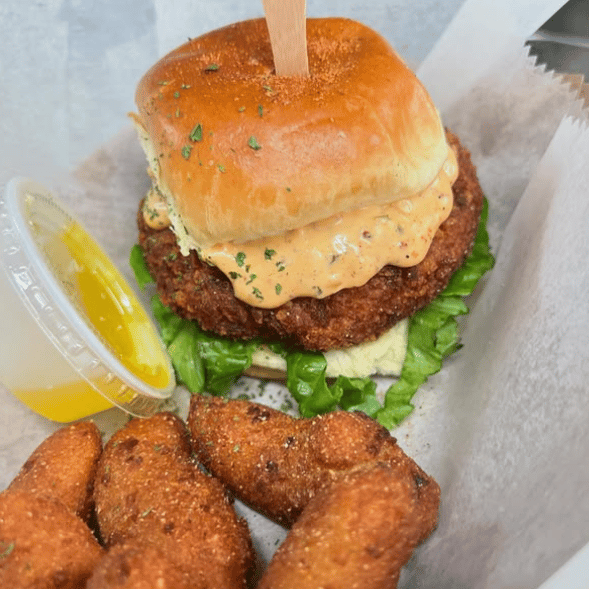 A hearty burger with some deep fried goodness on the side from Prime 757