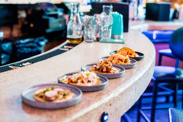 bar with 5 plates of food