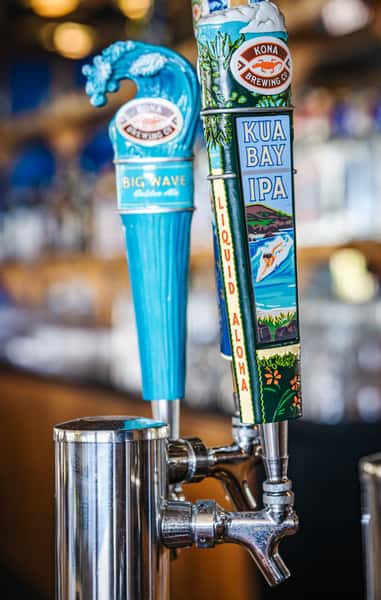 draft beer taps at a bar featuring local craft beers in a casual restaurant setting