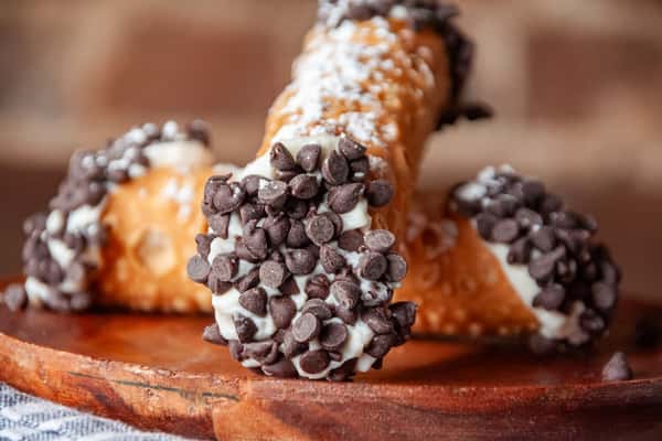 Have you tried our homemade cannoli yet? With a crisp shell and creamy filling, it's made from a family recipe passed down through generations in Italy. You simply can't beat it