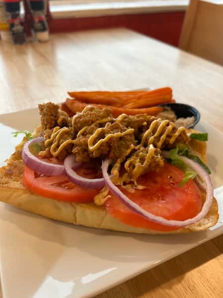 Grilled meat bits on a salad sandwich