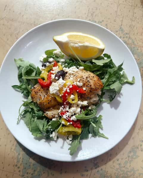 Seafood salad with cheese and a slice of lemon