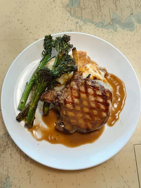 Saucy grilled steak with a side of greens