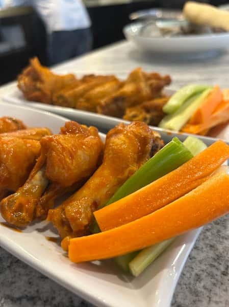 Chicken pieces and a side of vegetables