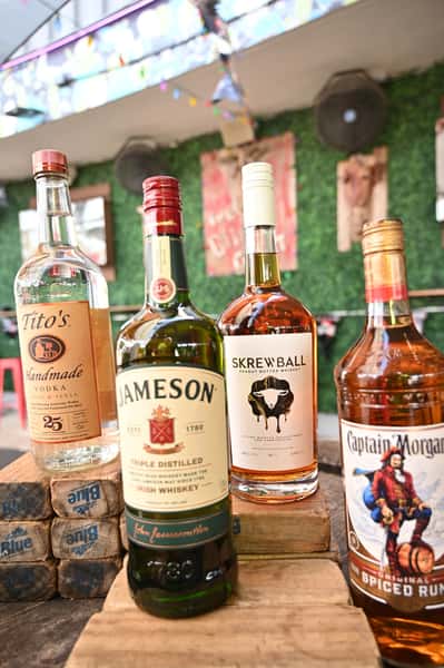 Tito's Handmade Vodka, Jameson Whiskey, Screwball Whiskey, & Captain Morgan Rum