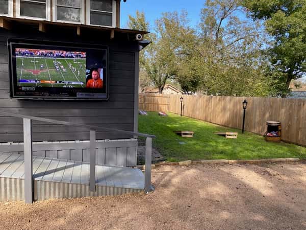 TV and cornhole area