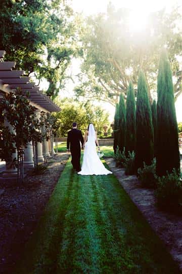 bride and groom on garden path