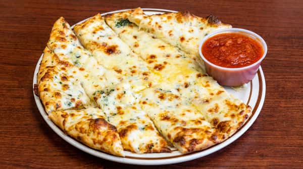 Cheesy garlic breadsticks with melted cheese and herbs, served with a side of marinara sauce.