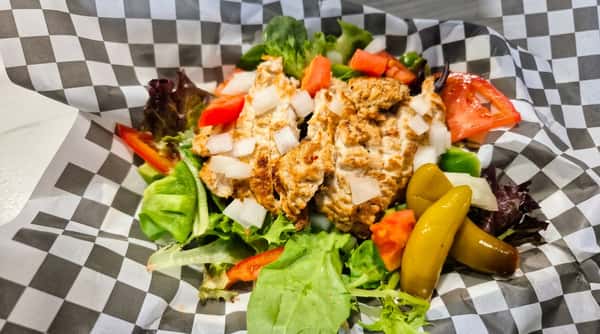 Chicken salad with lettuce, diced tomatoes, onions, peppers, and green pickled sport peppers.