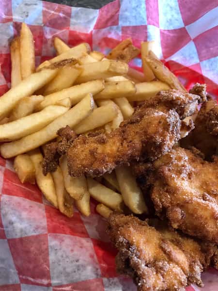 fried chicken and a side of fries in a basket