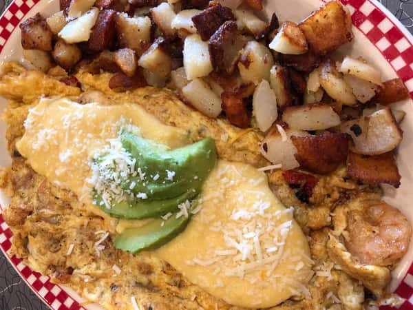 a seafood omelette with a side of home fries