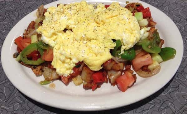 Vegetables with scrambled eggs on top