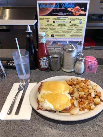 Two eggs with side of potatoes