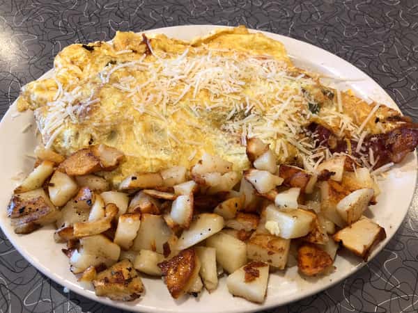 a breakfast omelette with a side of home fries