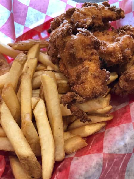 fried chicken and a side of fries in a basket