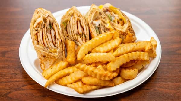 Chicken shawarma wraps with crinkle-cut fries on a white paper plate.