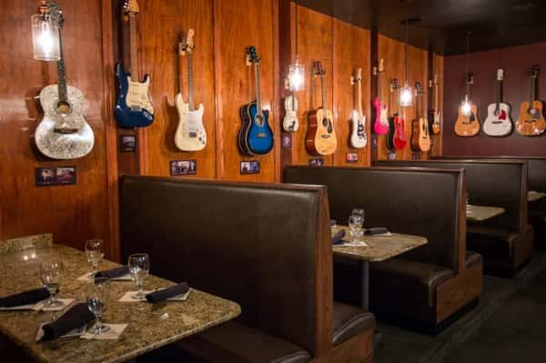 mounted guitars over booth seating