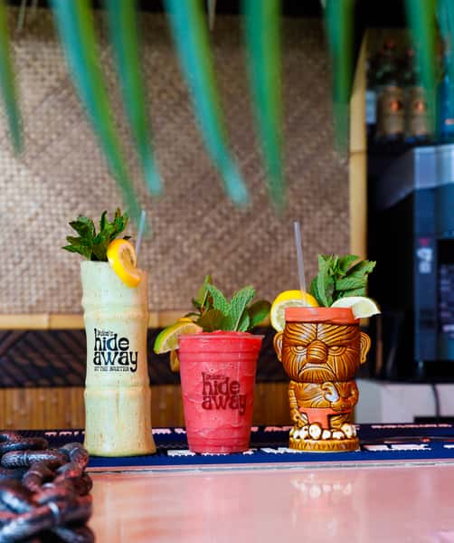 Three tiki themed cocktails