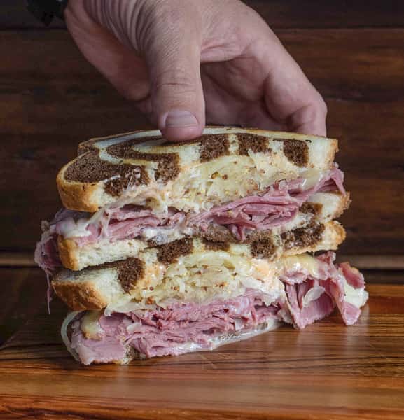 Classic Reuben sandwich on toasted marble rye with sauerkraut
