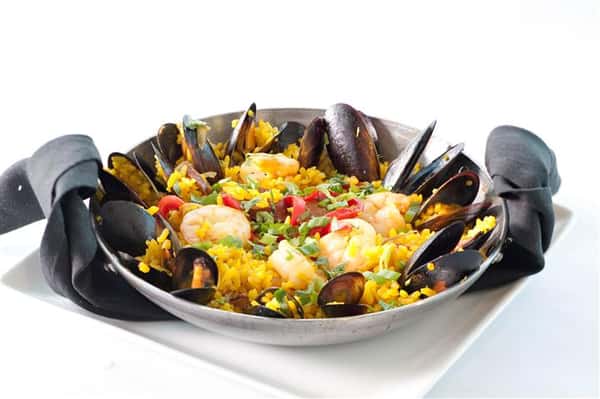 Yellow rice served with shrimp and scallops