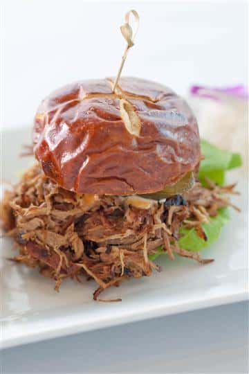 Burger served with shredded beef and lettuce