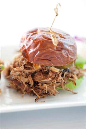 Burger served with shredded beef and lettuce