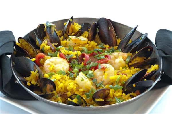 Yellow rice served with shrimp and scallops
