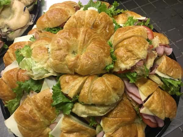 tray of croissant sandwiches