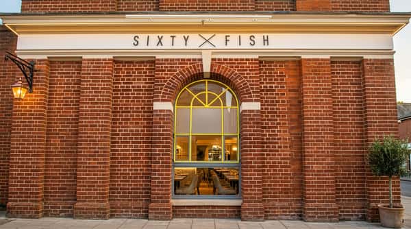 Front entrance of Sixty Fish on High Street in Coleshill, featuring the restaurant's distinctive brick exterior.