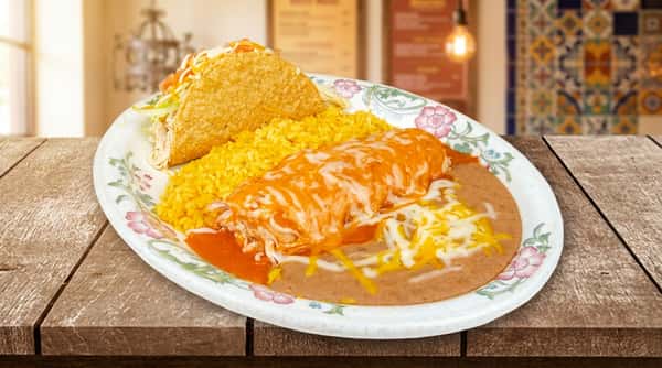 A classic Mexican combo plate with a burrito covered in sauce and melted cheese, served alongside rice and beans. The dish is simple, satisfying, and full of traditional flavor.