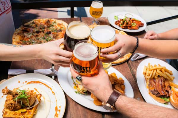 Beer toast on table with food