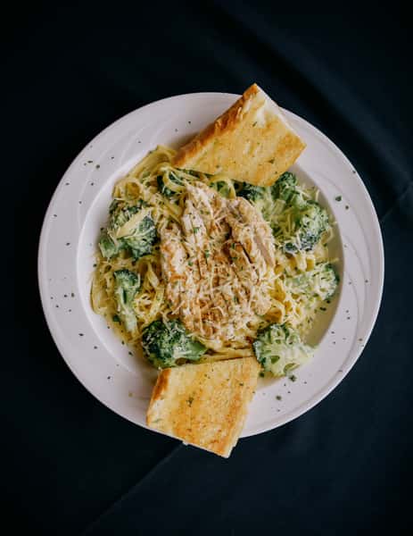 Tossed in a creamy Alfredo sauce with fresh broccoli.