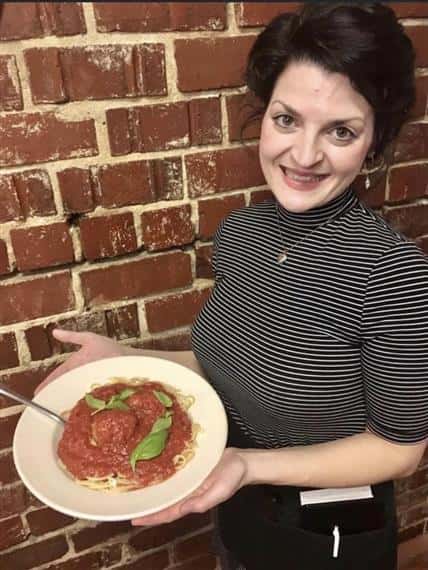 Co-Owner with Pasta Dish