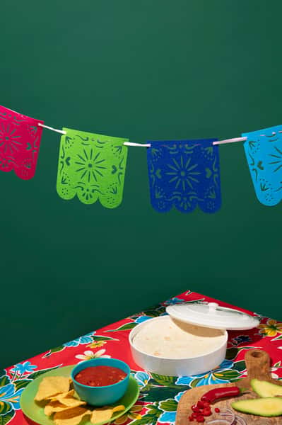 green bg with flags and table food