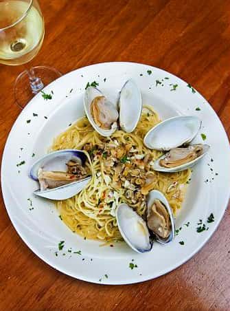 clams over linquine pasta in a clam sauce