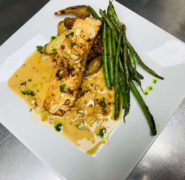 Honey Almond Crusted Salmon, finished with a Rosemary Sweet Vermouth Beurre Blanc, Fresh Herb Garlic Oil and a Cabernet Reduction