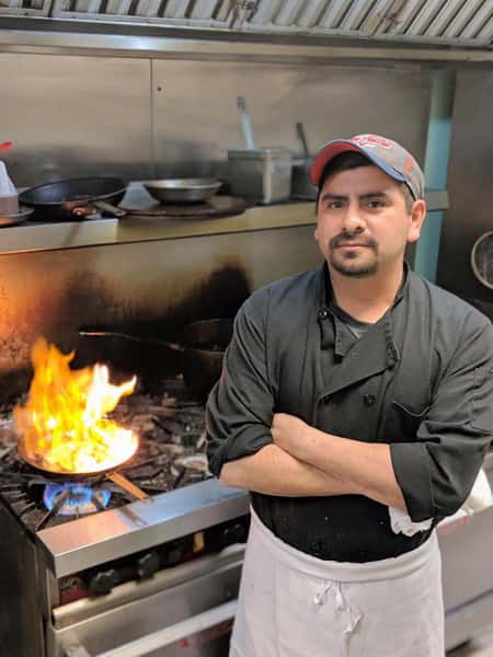 chef posing in the kitchen for a photo