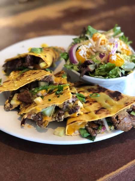 grilled steak quesadilla with a side salad
