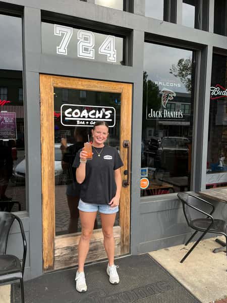 person outside coach's