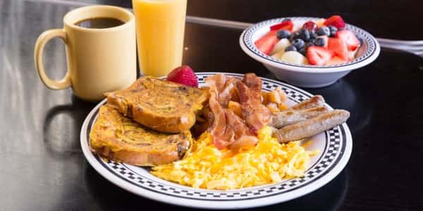 breakfast plate with fruit bowl and coffee