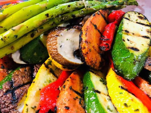 assorted grilled vegetables including asparagus, zucchini, carrot and potato