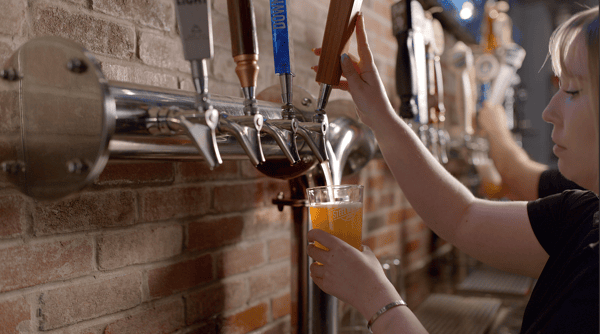 Bartender pouring beer