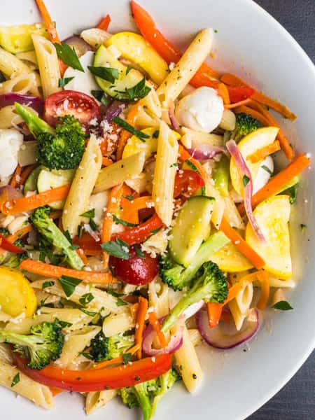 Nataz Penne Pasta Primavera dish, brightly colored with broccoli, carrots, squash, red peppers, and mozzarella cheese.