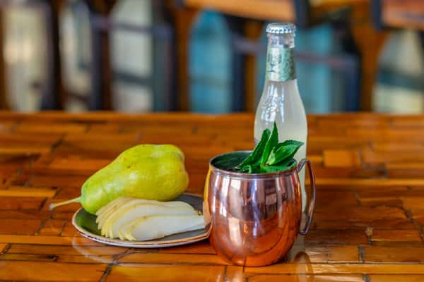 pear cocktail in copper tumbler